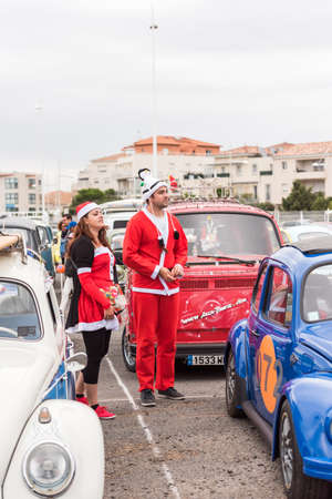 AGDE, FRANCE - SEPTEMBER 9, 2017: People in New Year's costumes at the exhibition of retro cars Volkswagen Cap d'Agde. Copy space for text. Verticalのeditorial素材