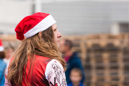 AGDE, FRANCE - SEPTEMBER 9, 2017: A man in a New Year's hat at an exhibition of retro cars Volkswagen. Close-upのeditorial素材