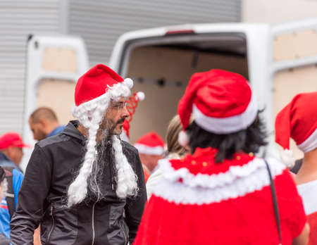 AGDE, FRANCE - SEPTEMBER 9, 2017: A man in a New Year's hat at an exhibition of retro cars Volkswagen. Close-upのeditorial素材