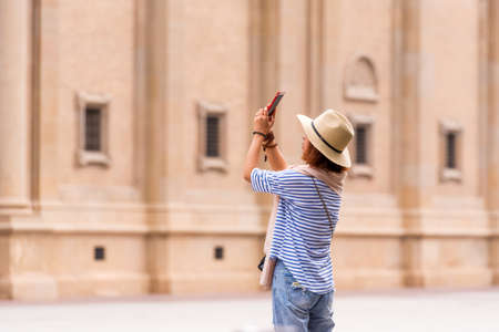 SARAGOSSA, SPAIN - SEPTEMBER 27, 2017: Tourist in Pilar Square. Copy space for textのeditorial素材