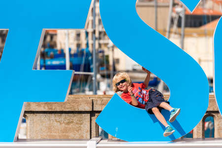 SETE, FRANCE - SEPTEMBER 10, 2017:  The child climbed the sculpture. Close-up.のeditorial素材
