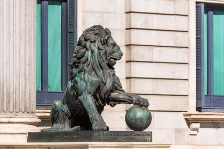 Statue of a lion Congress of Deputies in Madrid, Spain. Close-upの写真素材