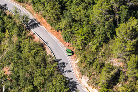 A car by the roadside in Siurana, Tarragona, Catalunya, Spain. Copy space for text. Top viewの写真素材
