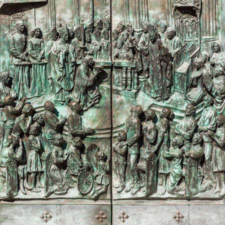 Bas-relief on the door of neo-gothic of Santa Maria la Real de La Almudena in Madrid, Spain. Close-upの写真素材