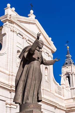 MADRID, SPAIN - SEPTEMBER 26, 2017: Sculpture on the background of the cathedral. Copy space for text. Vertical.のeditorial素材