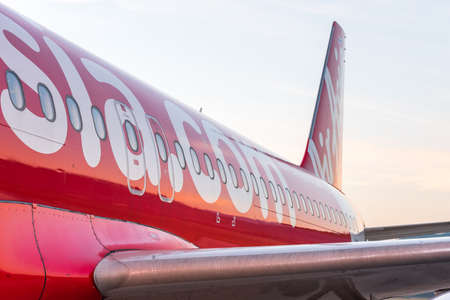 LOUANGPHABANG, LAOS - JANUARY 11, 2017: The tail of the plane against the background of the misty sky. Close-upのeditorial素材