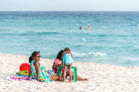 BAYAHIBE, DOMINICAN REPUBLIC - MAY 21, 2017: People on the sandy beach. Copy space for textのeditorial素材