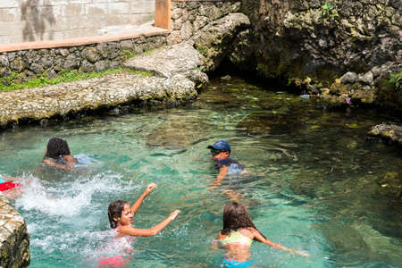 BAYAHIBE, DOMINICAN REPUBLIC - MAY 21, 2017: People bathe in the natural lakeのeditorial素材