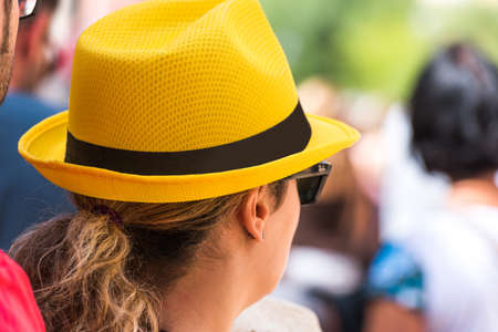 TARRAGONA, SPAIN - SEPTEMBER 17, 2017: Woman in a yellow hat. Close-upの写真素材