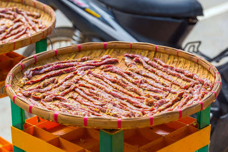 Meat with spices on a city street in Louangphabang, Laos. Close-upの写真素材