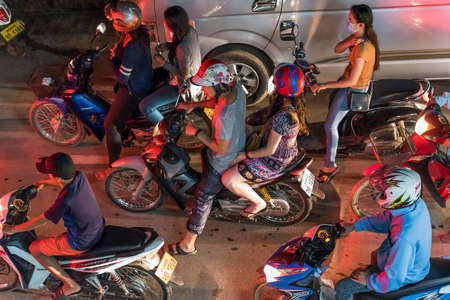 LOUANGPHABANG, LAOS - JANUARY 11, 2017: A group of people on motorcycles. Top viewのeditorial素材