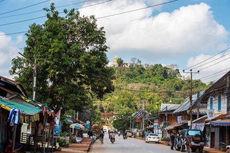 LUANG PRABANG, LAOS - JANUARY 11, 2017: View of buildings in the background of a mountain landscape. Copy space for textのeditorial素材
