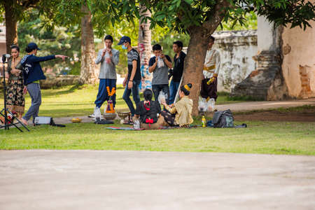 LUANG PRABANG, LAOS - JANUARY 11, 2017: Backstage in the open air in national costumes. Copy space for textのeditorial素材