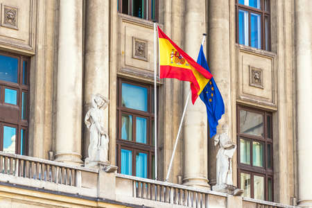 View of the flags on the facade of the building in Madrid, Spain. Close-upの写真素材