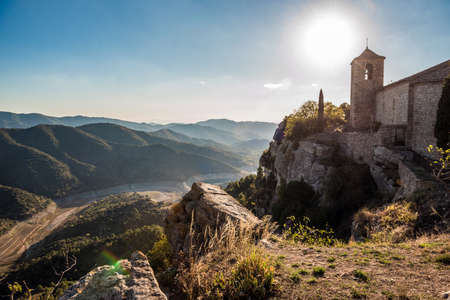 View of the Romanesque church of Santa Maria de Siurana at sunset in Siurana de Prades, Tarragona, Spain. Copy space for textのeditorial素材