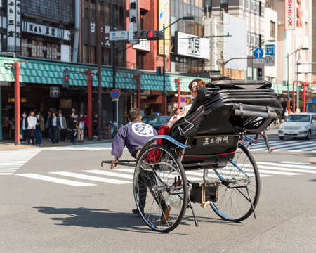 TOKYO, JAPAN - OCTOBER 31, 2017: Rickshaw on the city street. Copy space for textのeditorial素材