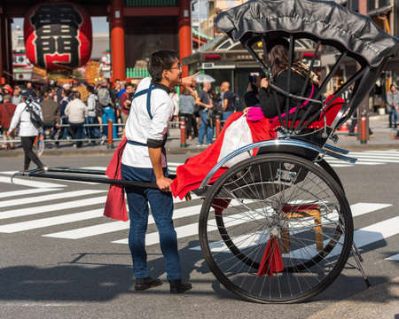 TOKYO, JAPAN - OCTOBER 31, 2017: Rickshaw on the city street. Copy space for textのeditorial素材