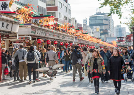 TOKYO, JAPAN - OCTOBER 31, 2017: Crowd of people on a city street. Copy space for textのeditorial素材