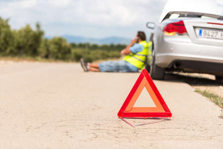 The car broke down on the road. Emergency sign close-up on the road, Tarragona, Catalunya, Spainの写真素材