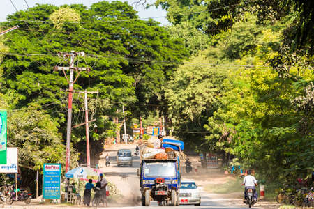 BAGAN, MYANMAR - DECEMBER 1, 2016: City landscape. Transport on the road. Copy space for textのeditorial素材