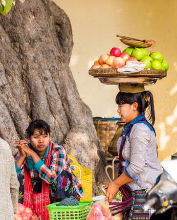BAGAN, MYANMAR - DECEMBER 1, 2016: The seller of fruit in the local market. Close-upのeditorial素材