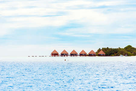 Water villas on tropical caribbean island, Maldives. Copy space for textのeditorial素材