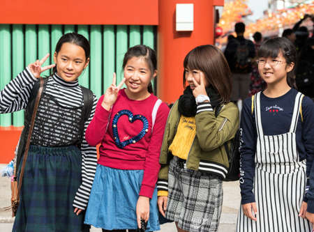 TOKYO, JAPAN - OCTOBER 31, 2017: Group of children on a city street. Close-upのeditorial素材