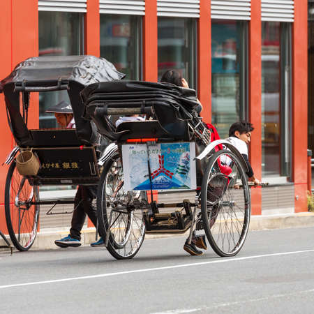 TOKYO, JAPAN - OCTOBER 31, 2017: Rickshaw on the city street. Copy space for text