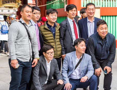 TOKYO, JAPAN - OCTOBER 31, 2017: Group of a man on a city street. Close-upのeditorial素材