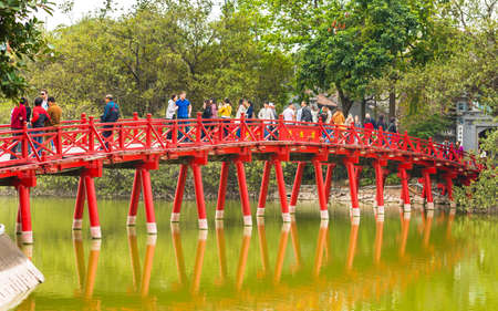 HANOI, VIETNAM - DECEMBER 16, 2016: Red bridge over a pond. Copy space for textのeditorial素材