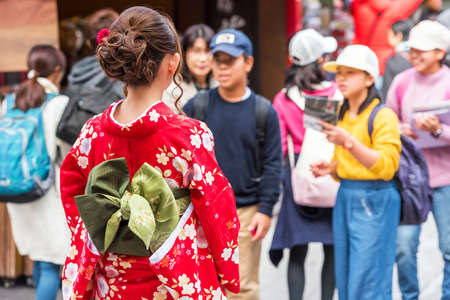 TOKYO, JAPAN - OCTOBER 31, 2017: The girl in a kimono on a city street. Back view. Close-upのeditorial素材