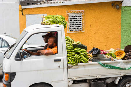 SANTO DOMINGO, DOMINICAN REPUBLIC - AUGUST 8, 2017: A car with fruits and vegetables on a city street. Close-upのeditorial素材