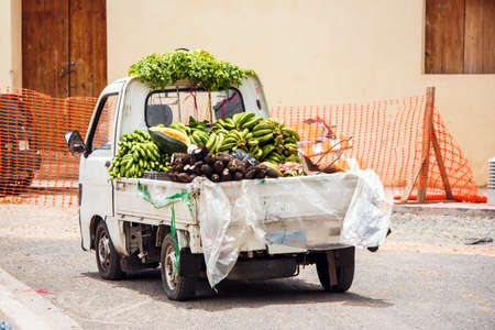 A car with fruits and vegetables on a city street, Santo Domingo, Dominican Republic. Copy space for textの写真素材