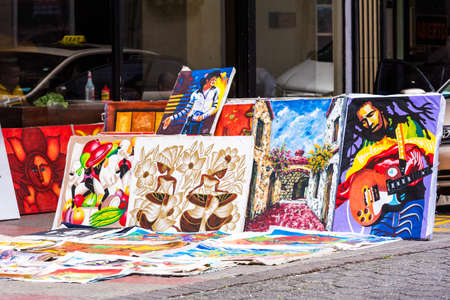 SANTO DOMINGO, DOMINICAN REPUBLIC - AUGUST 8, 2017: Sale of pictures on city street. Copy space for textのeditorial素材