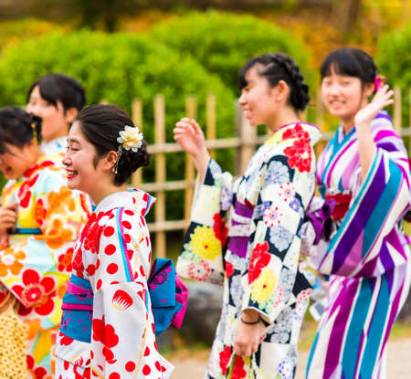 KYOTO, JAPAN - NOVEMBER 7, 2017: Group of girls in a kimono on a city street. Close-upのeditorial素材