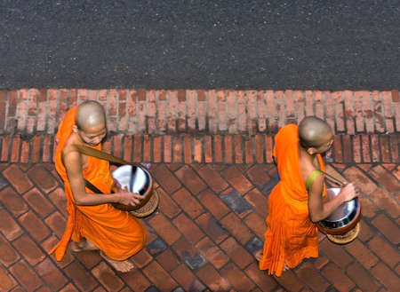 LUANG PRABANG, LAOS - JANUARY 11, 2017: Monks in the city street. Top view. Copy space for textのeditorial素材