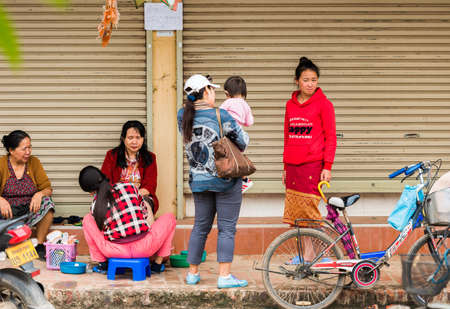 LUANG PRABANG, LAOS - JANUARY 11, 2017: Group of women on a city street. Copy space for textのeditorial素材