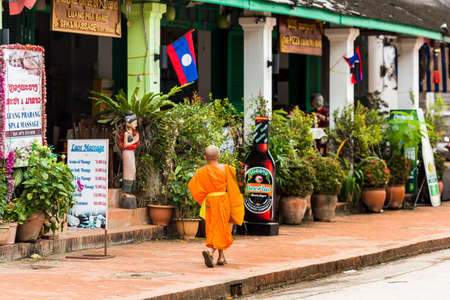 LUANG PRABANG, LAOS - JANUARY 11, 2017: Little monk on a city street. Copy space for textのeditorial素材