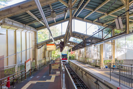 HAKONE, JAPAN - NOVEMBER 5, 2017: View of the red train at the railway station. Copy space for textのeditorial素材