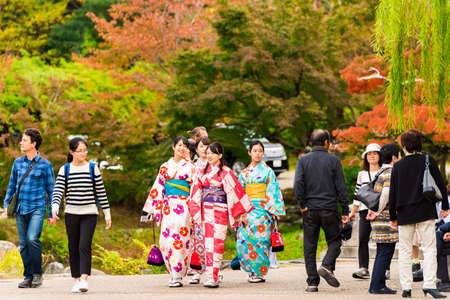 KYOTO, JAPAN - NOVEMBER 7, 2017: Group of girls in a kimono on a city street. Copy space for textのeditorial素材