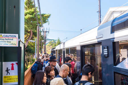 HAKONE, JAPAN - NOVEMBER 5, 2017: People at the railway station. Copy space for text