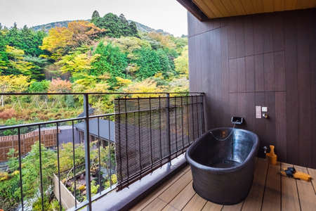 HAKONE, JAPAN - NOVEMBER 5, 2017: Bathtub on the balcony of the hotel with a view of the forest. Copy space for textのeditorial素材