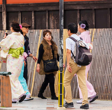 KYOTO, JAPAN - NOVEMBER 7, 2017: Girls in a kimono on a city streetのeditorial素材