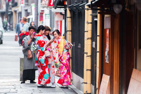 KYOTO, JAPAN - NOVEMBER 7, 2017: Girls in a kimono on a city street. Copy space for textのeditorial素材