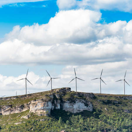 View of the windmills on the mountain in Tarragona, Spain. Copy space for text