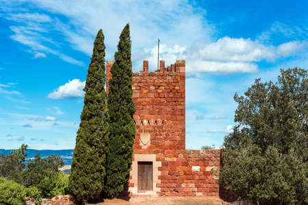 Old monastery Escornalbou in Spain, Tarragona, on the mountain with blue sky, entrance. Copy space for textの写真素材