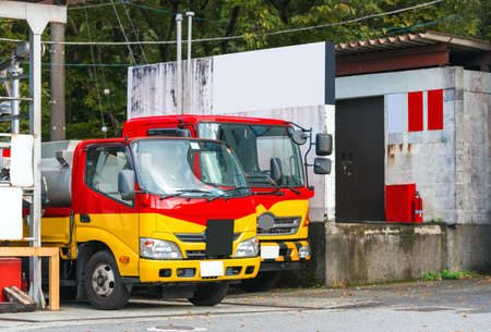 HAKONE, JAPAN - NOVEMBER 5, 2017: Two small trucks parked on the street. Copy space for textのeditorial素材