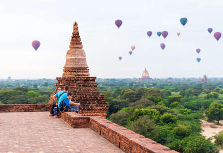 BAGAN, MYANMAR - DECEMBER 1, 2016: People against the background of flying balls. Copy space for textのeditorial素材