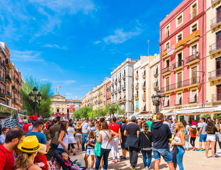 TARRAGONA, SPAIN - SEPTEMBER 17, 2017: Holiday of Santa Tecla, a crowd of people in the square. Copy space for textのeditorial素材
