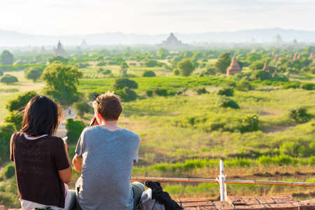 Couple against the background of the landscape and pagodas in Bagan, Myanmar